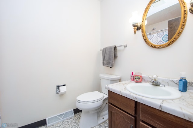 bathroom with visible vents, toilet, and vanity