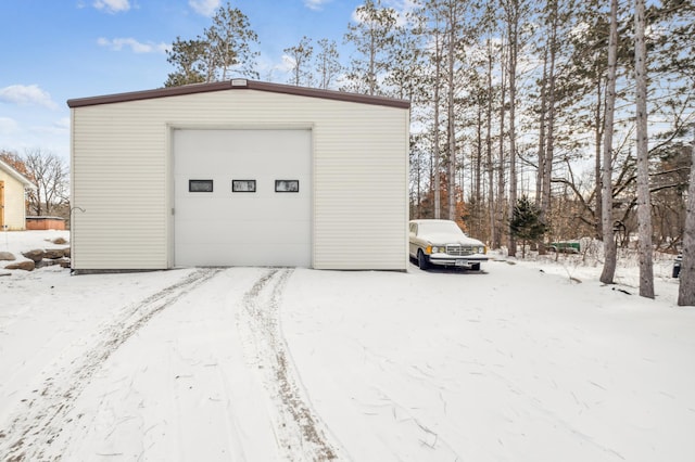 view of snow covered garage