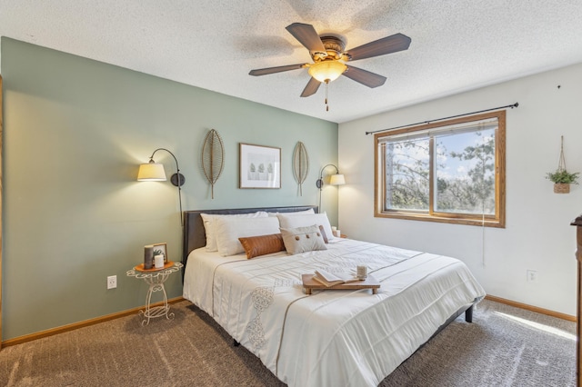 carpeted bedroom with ceiling fan, a textured ceiling, and baseboards