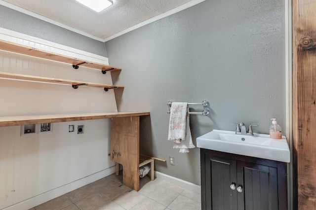 laundry room with light tile patterned floors, laundry area, a sink, washer hookup, and electric dryer hookup