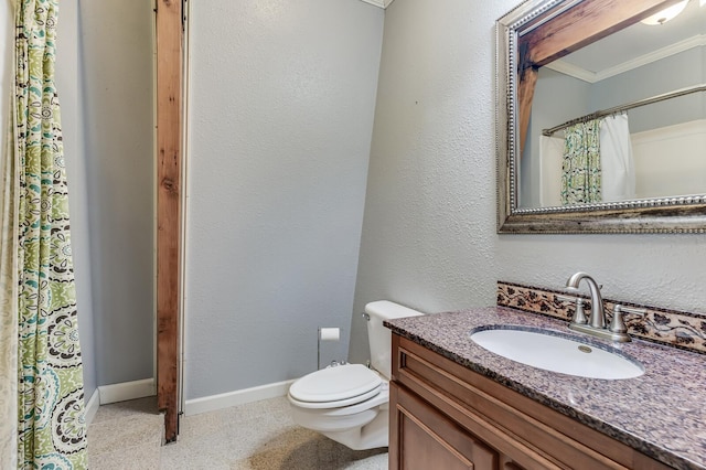 full bathroom with baseboards, toilet, ornamental molding, a textured wall, and vanity