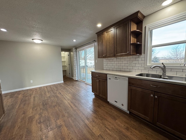 kitchen with a sink, backsplash, dark wood-type flooring, dishwasher, and open shelves