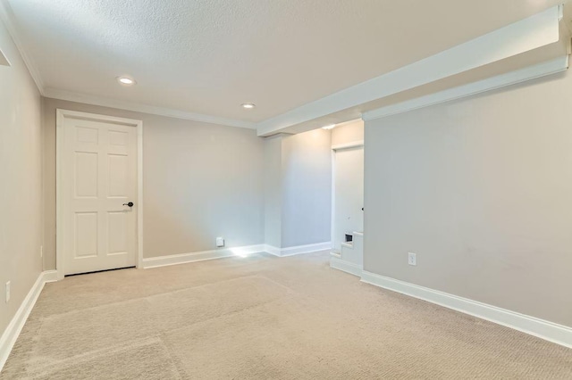 unfurnished room with baseboards, light colored carpet, ornamental molding, recessed lighting, and a textured ceiling