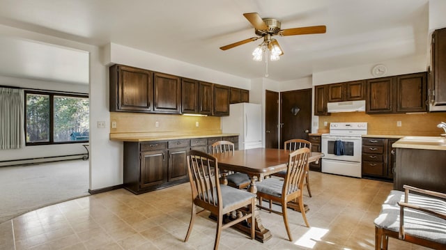 kitchen featuring dark brown cabinets, a baseboard heating unit, under cabinet range hood, light countertops, and white appliances