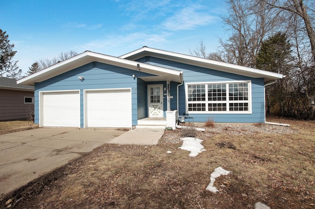 view of front of property featuring a garage and driveway