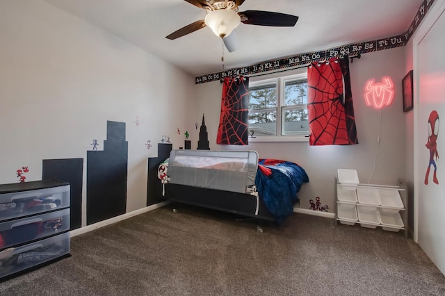 carpeted bedroom featuring ceiling fan and baseboards