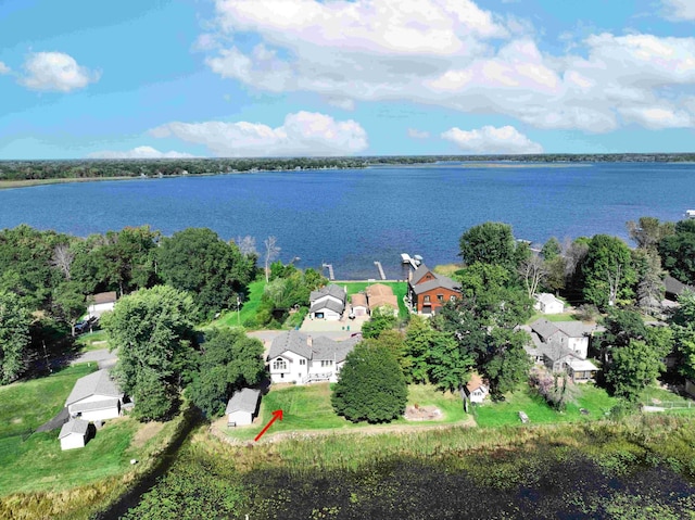 bird's eye view with a residential view and a water view