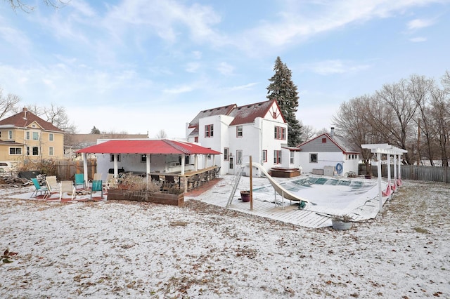 back of property featuring a patio area, a jacuzzi, a fenced backyard, and a residential view