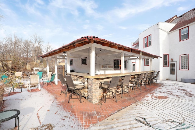 view of patio / terrace featuring an outdoor bar