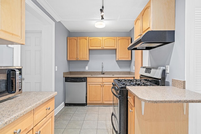 kitchen with a sink, light tile patterned flooring, light brown cabinetry, and stainless steel appliances