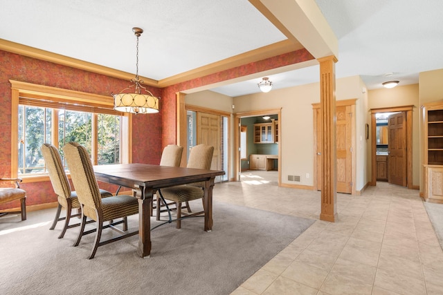 dining space featuring baseboards, visible vents, decorative columns, light tile patterned flooring, and light carpet