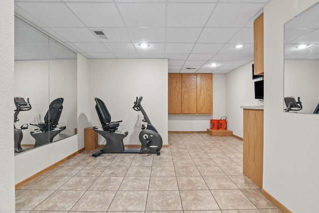 workout room featuring visible vents, a drop ceiling, recessed lighting, light tile patterned flooring, and baseboards