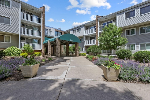 view of home's community featuring concrete driveway