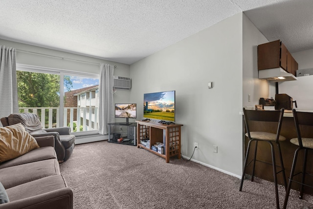 carpeted living area featuring a textured ceiling, a wall mounted air conditioner, and baseboards