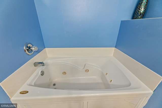 bathroom with a whirlpool tub