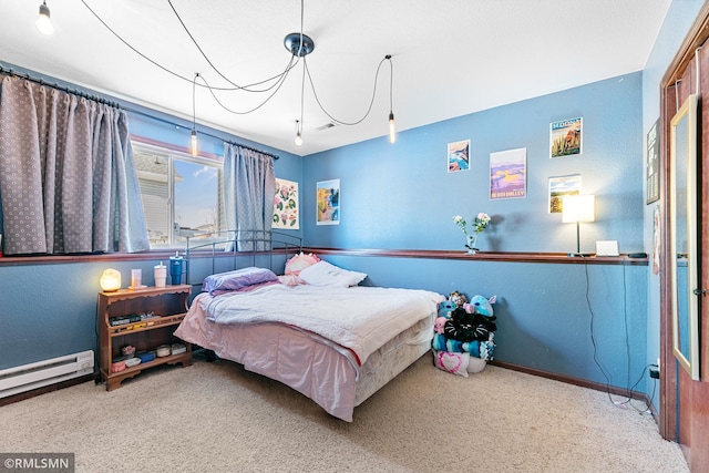 carpeted bedroom featuring baseboards and baseboard heating