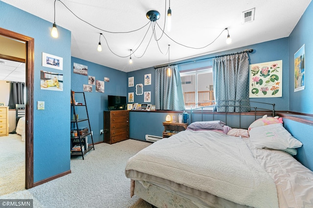 carpeted bedroom with visible vents and baseboard heating