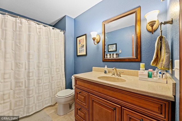 bathroom with a shower with curtain, toilet, vanity, and tile patterned flooring