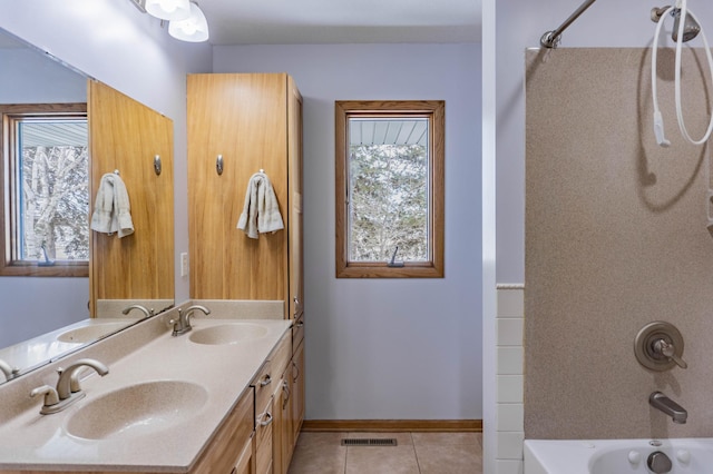 bathroom featuring tile patterned floors, visible vents, bathing tub / shower combination, and a sink