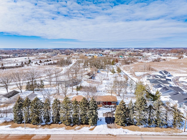 snowy aerial view with a residential view