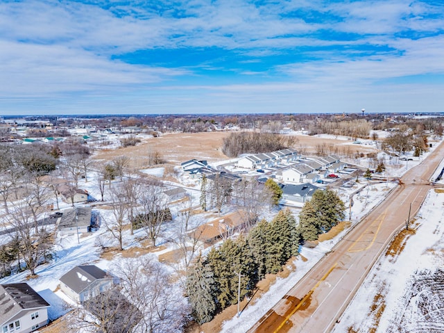 snowy aerial view with a residential view