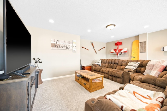 carpeted living area featuring recessed lighting and baseboards