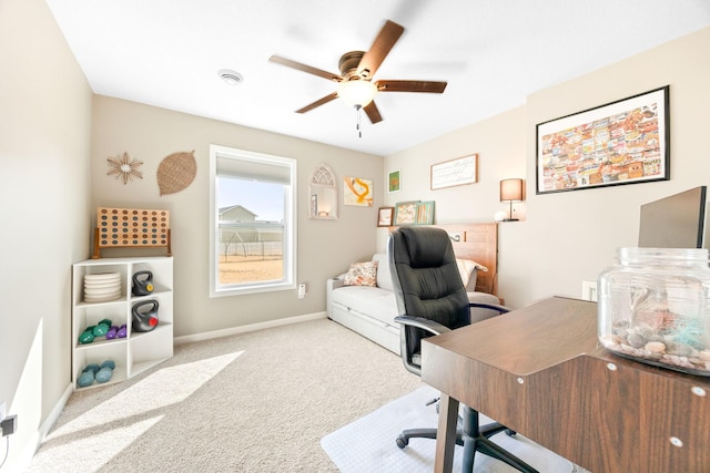 office area with baseboards, carpet floors, and a ceiling fan