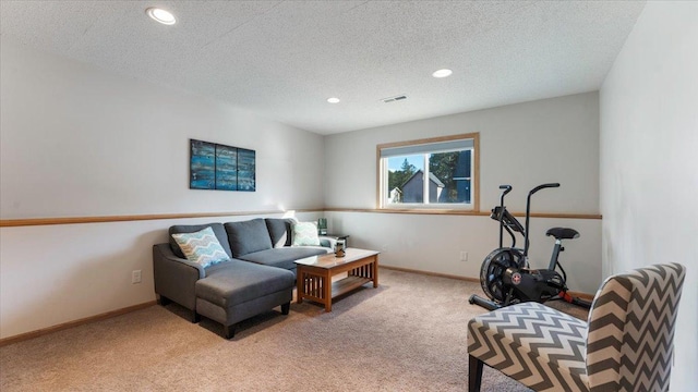 carpeted living room featuring visible vents, recessed lighting, a textured ceiling, and baseboards