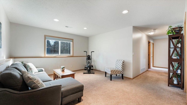 sitting room with recessed lighting, a textured ceiling, and baseboards