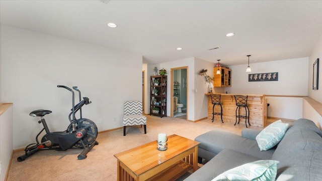 living area featuring recessed lighting, baseboards, carpet, and a dry bar