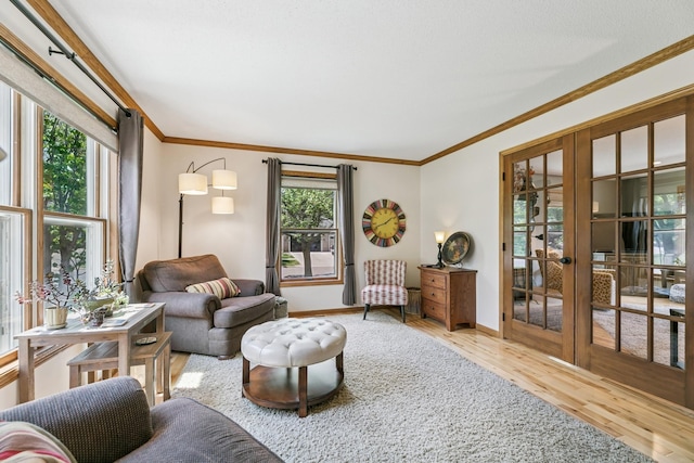 2415 Field Ct, Saint Cloud, MN 56301 - living area with french doors, wood finished floors, ornamental molding, and baseboards