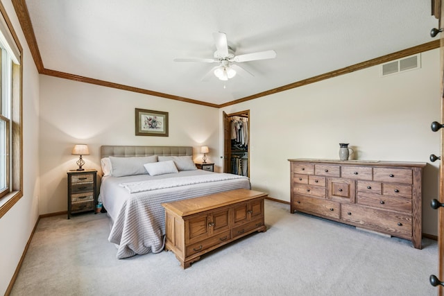 2415 Field Ct, Saint Cloud, MN 56301 - bedroom featuring light colored carpet, baseboards, crown molding, and a closet