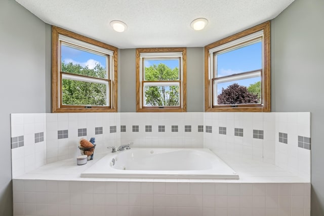 2415 Field Ct, Saint Cloud, MN 56301 - bathroom with a garden tub and a textured ceiling