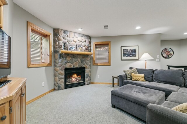 2415 Field Ct, Saint Cloud, MN 56301 - carpeted living area featuring baseboards, a stone fireplace, and recessed lighting