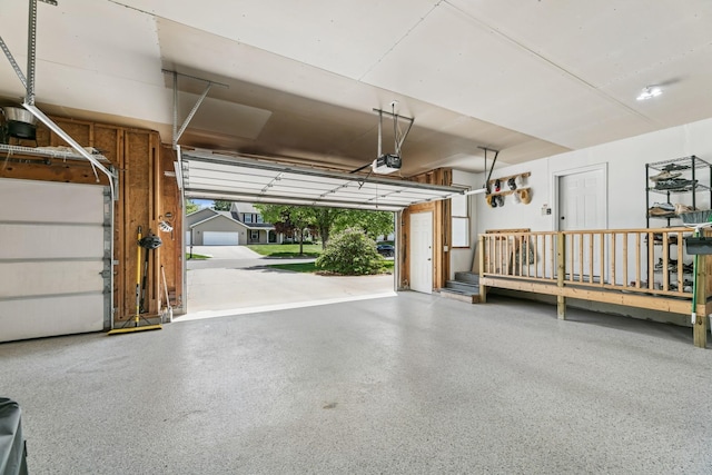 2415 Field Ct, Saint Cloud, MN 56301 - garage featuring a garage door opener and covered porch