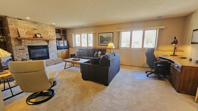 living area featuring a brick fireplace, baseboards, built in features, light colored carpet, and a textured ceiling