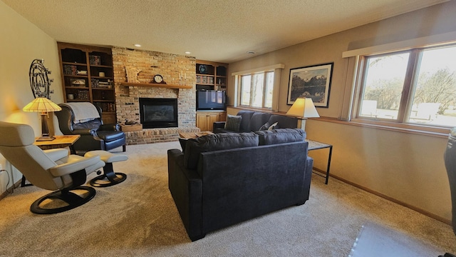 carpeted living area featuring built in shelves, a fireplace, baseboards, and a textured ceiling