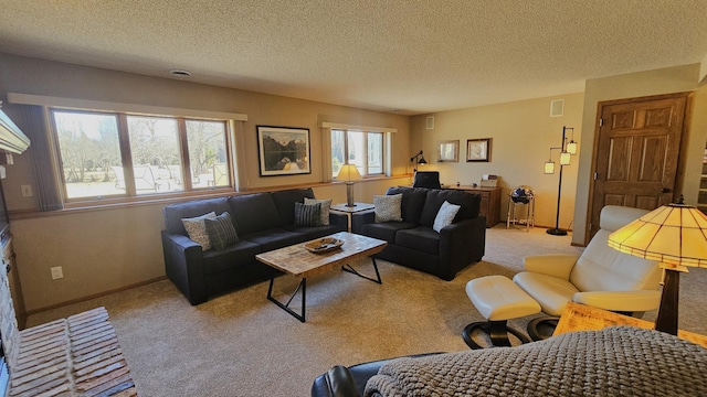 living room with baseboards, light carpet, and a textured ceiling