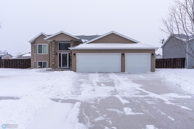 view of front of home featuring fence