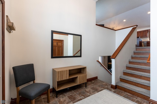 interior space with stone finish floor, recessed lighting, and baseboards