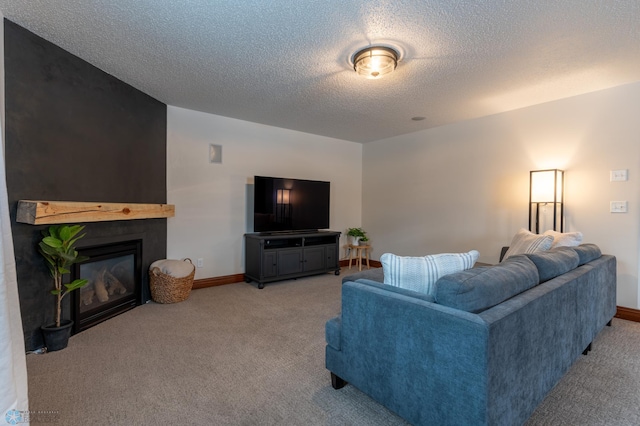 living area featuring baseboards, light colored carpet, a fireplace, and a textured ceiling