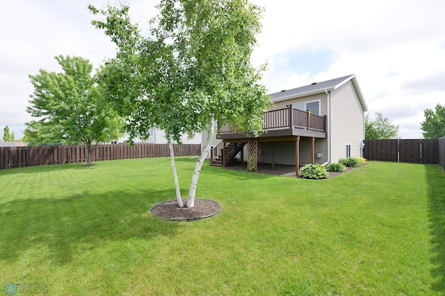 view of yard featuring stairway, a wooden deck, and a fenced backyard