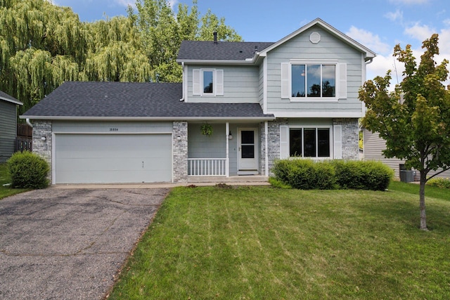 18884 Pennington Ave, Eden Prairie, MN 55346 - traditional-style home featuring asphalt driveway, a front lawn, an attached garage, and roof with shingles