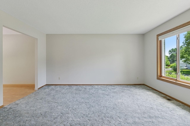18884 Pennington Ave, Eden Prairie, MN 55346 - carpeted empty room featuring baseboards