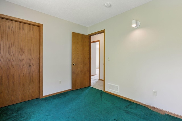 18884 Pennington Ave, Eden Prairie, MN 55346 - unfurnished bedroom featuring carpet floors and a closet