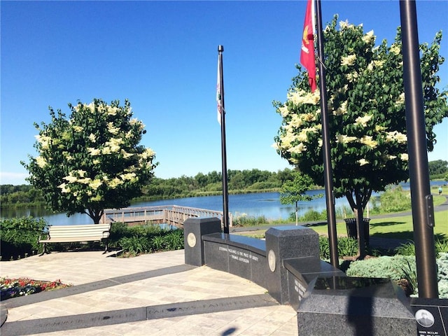 view of patio with a water view