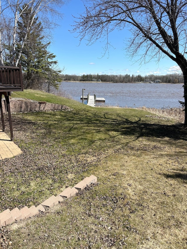 1421 Riverside Dr NW, Baudette, MN 56623 - view of green lawn featuring a water view and a boat dock