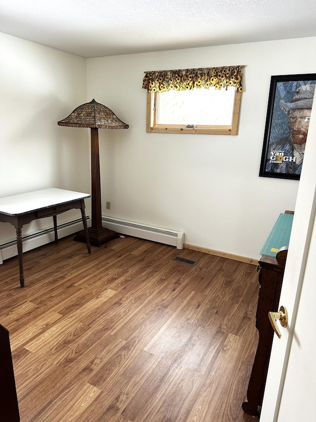 1421 Riverside Dr NW, Baudette, MN 56623 - spare room featuring wood finished floors and baseboards