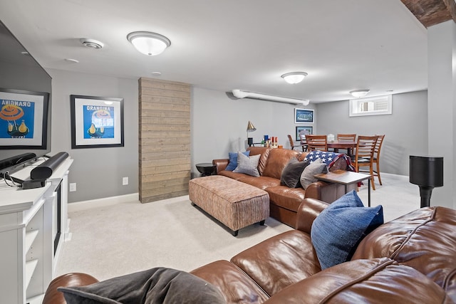 living room with light carpet and baseboards