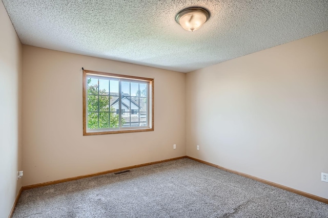 16786 Embers Ave, Lakeville, MN 55024 - carpeted empty room with a textured ceiling and baseboards